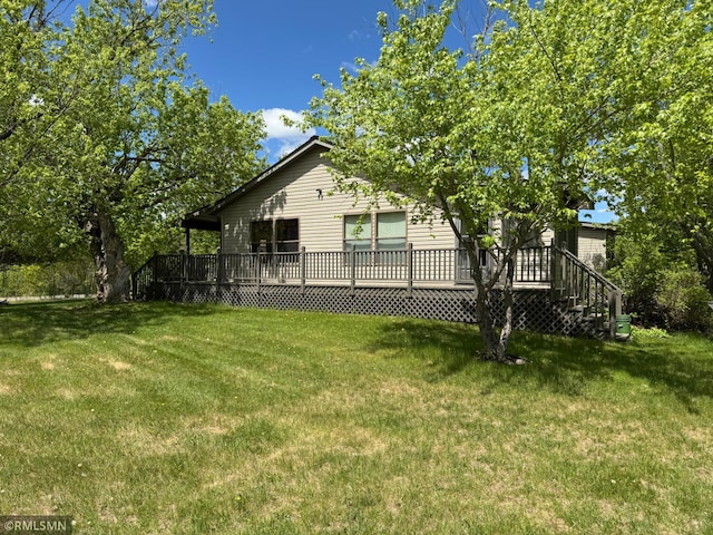 26612 State Highway 47, Aitkin, MN 56431 - view of home's exterior featuring a wooden deck and a lawn
