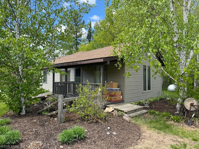 26612 State Highway 47, Aitkin, MN 56431 - view of front of house featuring roof with shingles and a porch