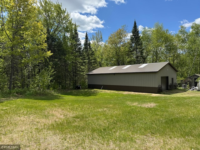 26612 State Highway 47, Aitkin, MN 56431 - view of green lawn featuring a pole building and an outdoor structure