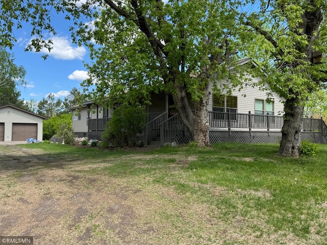 26612 State Highway 47, Aitkin, MN 56431 - view of green lawn with a detached garage and an outdoor structure