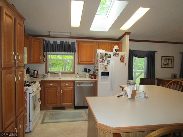 26612 State Highway 47, Aitkin, MN 56431 - kitchen featuring white appliances, a sink, brown cabinets, and crown molding