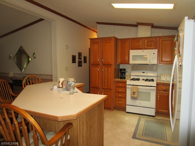 26612 State Highway 47, Aitkin, MN 56431 - kitchen featuring white appliances, crown molding, brown cabinetry, a breakfast bar, and light countertops