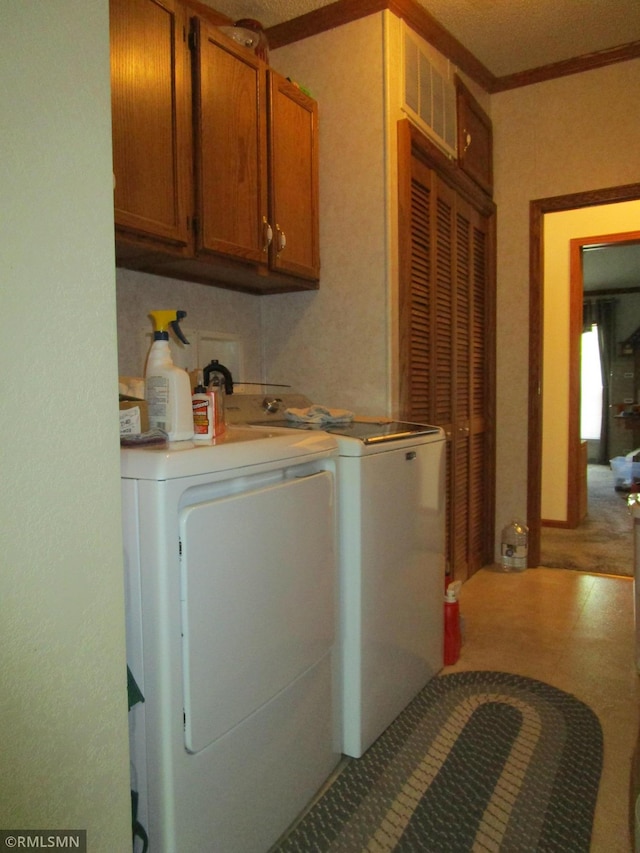 26612 State Highway 47, Aitkin, MN 56431 - laundry room with cabinet space, washing machine and dryer, and crown molding
