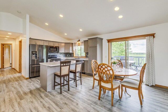 918 Mallard St NE, Hanover, MN 55341 - dining space featuring lofted ceiling, light wood finished floors, plenty of natural light, recessed lighting, and baseboards