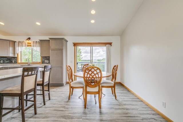 918 Mallard St NE, Hanover, MN 55341 - dining area featuring recessed lighting, light wood-type flooring, baseboards, and vaulted ceiling