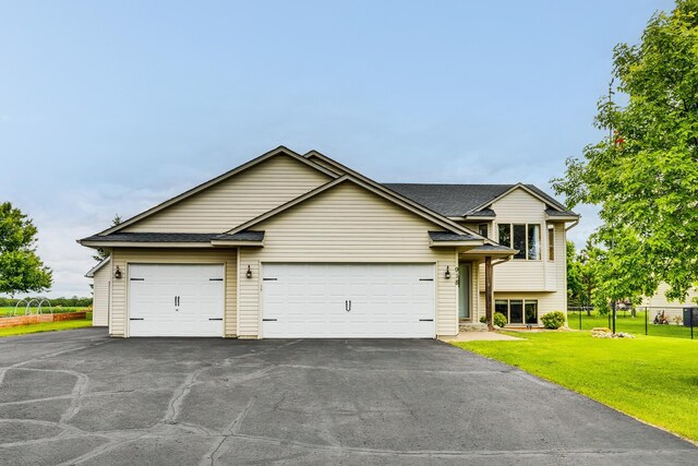 918 Mallard St NE, Hanover, MN 55341 - view of front of property with driveway, a shingled roof, and an attached garage