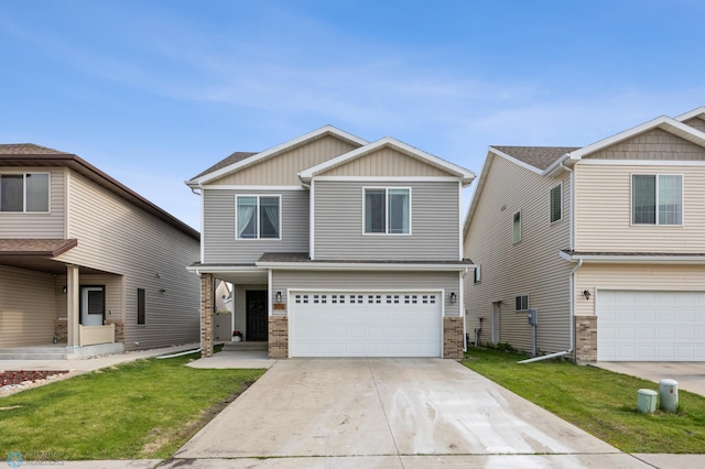 934 31st Ave W, West Fargo, ND 58078 - view of front of house featuring a garage, a front yard, driveway, board and batten siding, and brick siding