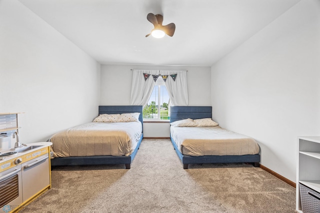 934 31st Ave W, West Fargo, ND 58078 - bedroom with carpet flooring, baseboards, and a ceiling fan