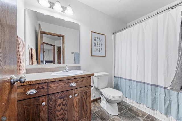 934 31st Ave W, West Fargo, ND 58078 - bathroom with toilet, vanity, baseboards, and curtained shower