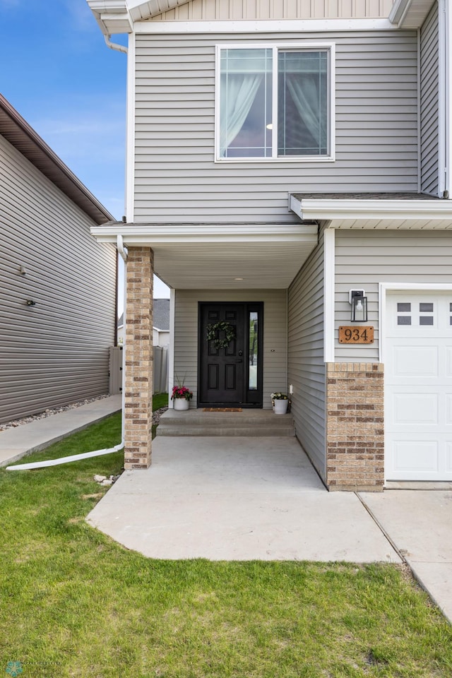 934 31st Ave W, West Fargo, ND 58078 - entrance to property with a yard and brick siding