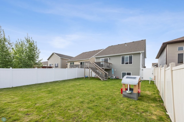 934 31st Ave W, West Fargo, ND 58078 - back of property with stairway and a wooden deck