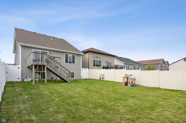 934 31st Ave W, West Fargo, ND 58078 - rear view of property featuring stairs, a wooden deck, a gate, and a shingled roof