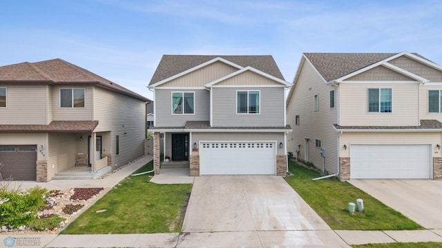 934 31st Ave W, West Fargo, ND 58078 - craftsman inspired home featuring a garage, a front lawn, and driveway