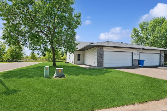185 21st Ave SW, Cambridge, MN 55008 - view of front of home featuring a front lawn, an attached garage, driveway, roof with shingles, and brick siding
