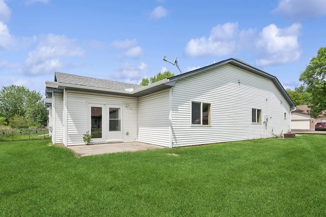 185 21st Ave SW, Cambridge, MN 55008 - rear view of property with a yard and a shingled roof