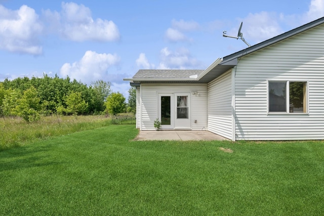 185 21st Ave SW, Cambridge, MN 55008 - back of house with a yard and a patio area