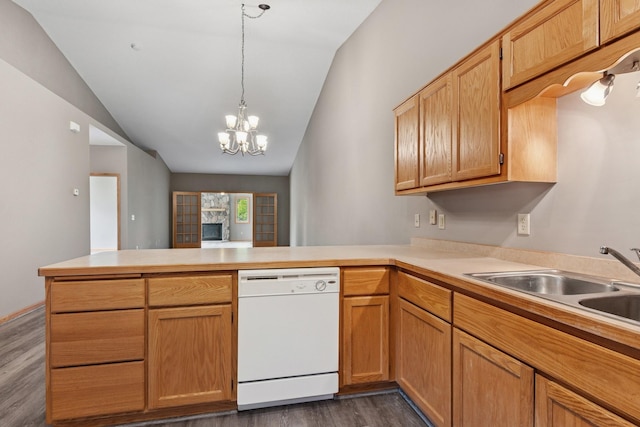 185 21st Ave SW, Cambridge, MN 55008 - kitchen featuring dishwasher, a peninsula, a sink, dark wood finished floors, and light countertops