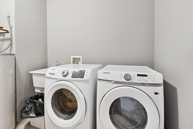 185 21st Ave SW, Cambridge, MN 55008 - laundry room with washing machine and clothes dryer and water heater