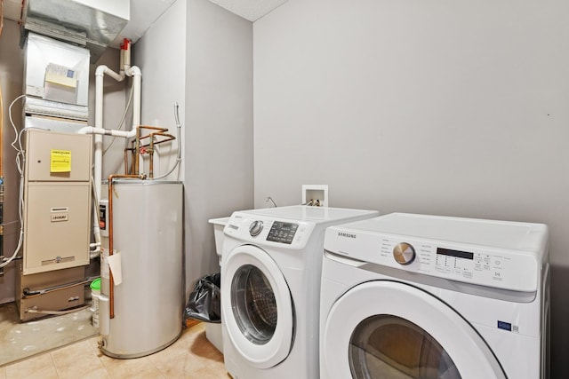 185 21st Ave SW, Cambridge, MN 55008 - laundry room with water heater, independent washer and dryer, and light tile patterned floors