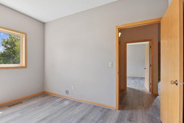 185 21st Ave SW, Cambridge, MN 55008 - spare room with wood finished floors and baseboards