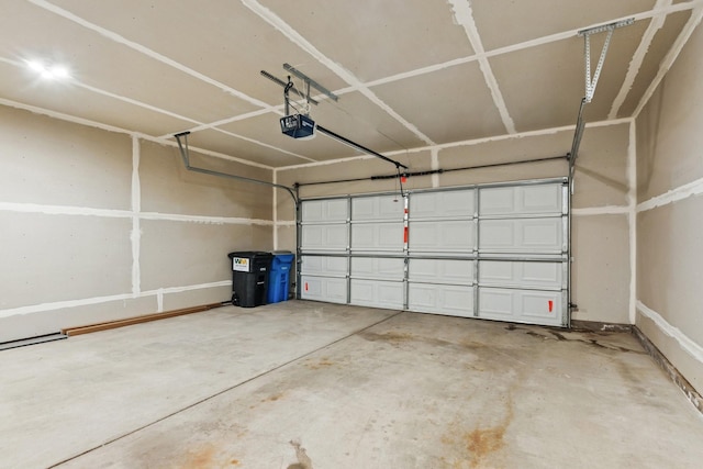 185 21st Ave SW, Cambridge, MN 55008 - garage with a garage door opener and baseboards