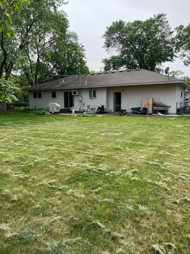 1602 8th Ave S, Saint Cloud, MN 56301 - rear view of property with a lawn