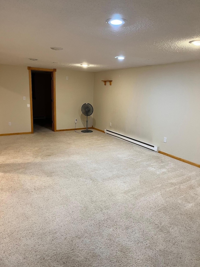 1602 8th Ave S, Saint Cloud, MN 56301 - spare room featuring baseboard heating, light carpet, recessed lighting, and a textured ceiling