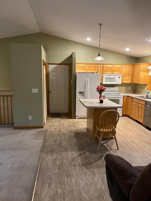 1602 8th Ave S, Saint Cloud, MN 56301 - kitchen with white appliances, lofted ceiling, light countertops, a center island, and pendant lighting