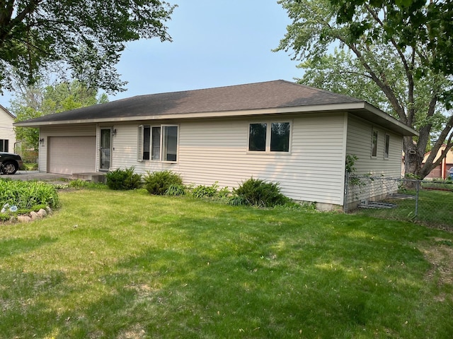 1602 8th Ave S, Saint Cloud, MN 56301 - view of front of home with a garage, asphalt driveway, and roof with shingles