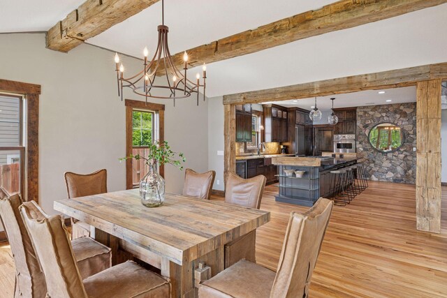 3920 Hawthorne Cir, Chanhassen, MN 55331 - dining room featuring beam ceiling, light wood-style flooring, and a chandelier