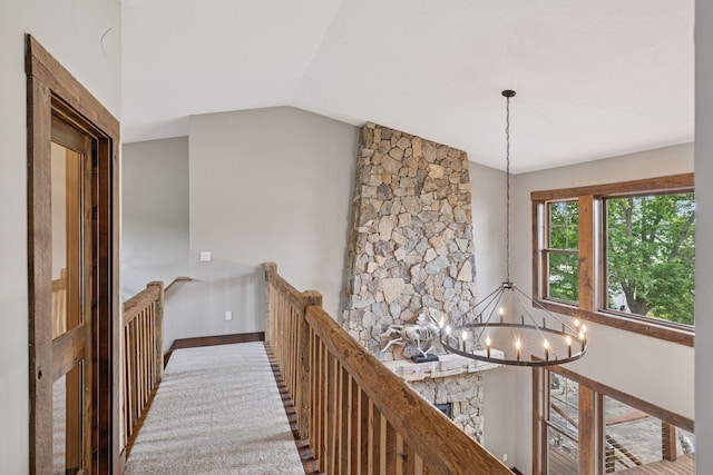 3920 Hawthorne Cir, Chanhassen, MN 55331 - corridor featuring a chandelier, an upstairs landing, vaulted ceiling, and baseboards