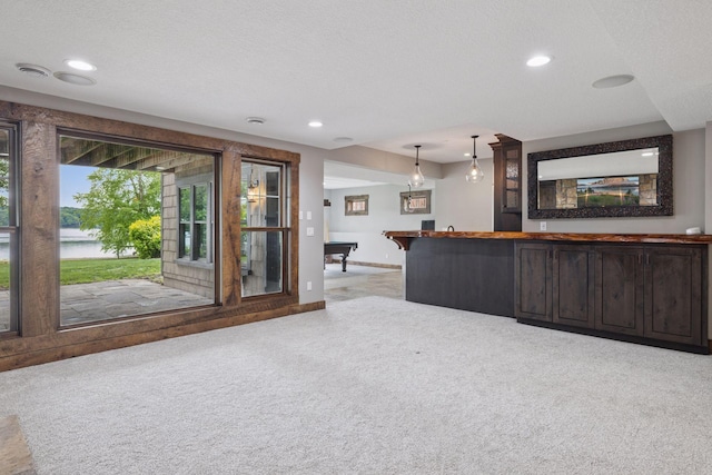 3920 Hawthorne Cir, Chanhassen, MN 55331 - kitchen featuring carpet floors, recessed lighting, baseboards, dark brown cabinets, and hanging light fixtures