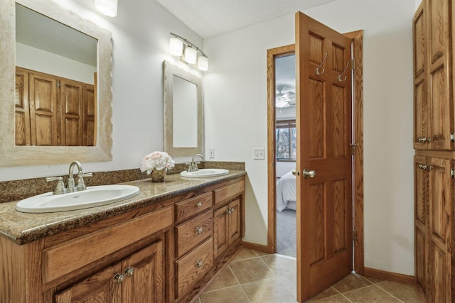 5929 Oxford St N, Shoreview, MN 55126 - bathroom with double vanity, tile patterned floors, and ensuite bath