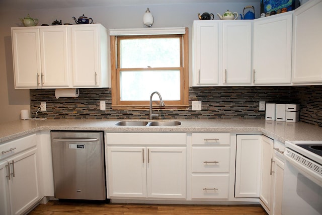 6014 6th St, Lake Park, MN 56554 - kitchen featuring stainless steel dishwasher, a sink, and white cabinetry