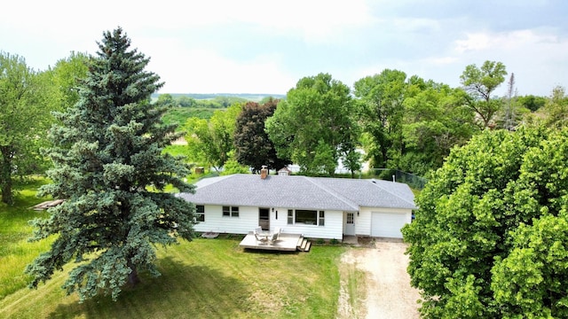6014 6th St, Lake Park, MN 56554 - view of front of house featuring an attached garage, dirt driveway, a front yard, and a deck