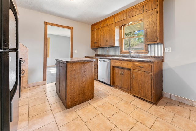 51470 Rush Lake Trl, Nessel Twp, MN 55069 - kitchen featuring dishwasher, a kitchen island, dark countertops, freestanding refrigerator, and a textured ceiling