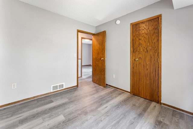 51470 Rush Lake Trl, Nessel Twp, MN 55069 - empty room with wood finished floors, baseboards, and a smoke detector