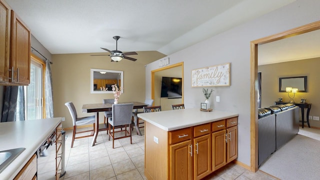 3224 48th St NW, Rochester, MN 55901 - kitchen with lofted ceiling, a ceiling fan, dishwasher, light countertops, and brown cabinetry