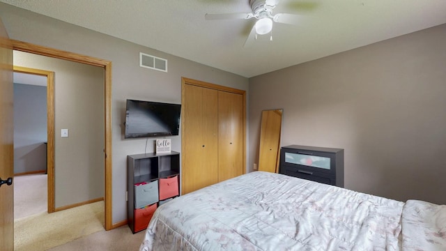 3224 48th St NW, Rochester, MN 55901 - bedroom featuring light colored carpet, a closet, baseboards, and a ceiling fan