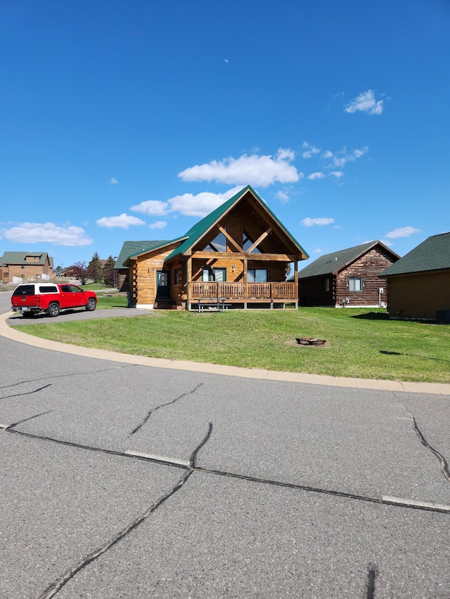 303 Hilltop Ct, Warrens, WI 54666 - cabin with a front yard and concrete driveway
