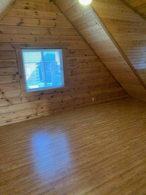 303 Hilltop Ct, Warrens, WI 54666 - bonus room with lofted ceiling, wood finished floors, wood walls, and wood ceiling