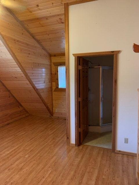 303 Hilltop Ct, Warrens, WI 54666 - hallway featuring wooden ceiling, lofted ceiling, light wood finished floors, and wooden walls