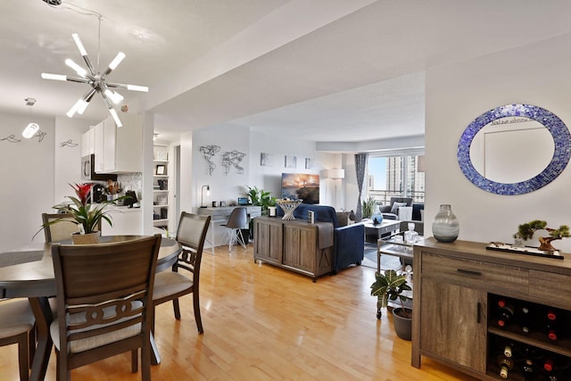 121 Washington Ave S Unit 1816, Minneapolis, MN 55401 - dining room featuring light wood-type flooring and a ceiling fan