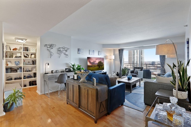121 Washington Ave S Unit 1816, Minneapolis, MN 55401 - living room with light wood-style flooring and a desk