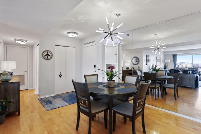 121 Washington Ave S Unit 1816, Minneapolis, MN 55401 - dining area featuring light wood-type flooring, baseboards, and a ceiling fan