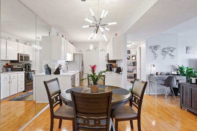 121 Washington Ave S Unit 1816, Minneapolis, MN 55401 - dining area with light wood-type flooring and a ceiling fan