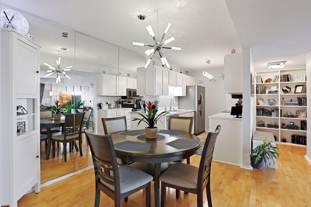 121 Washington Ave S Unit 1816, Minneapolis, MN 55401 - dining area with a ceiling fan and light wood-style floors