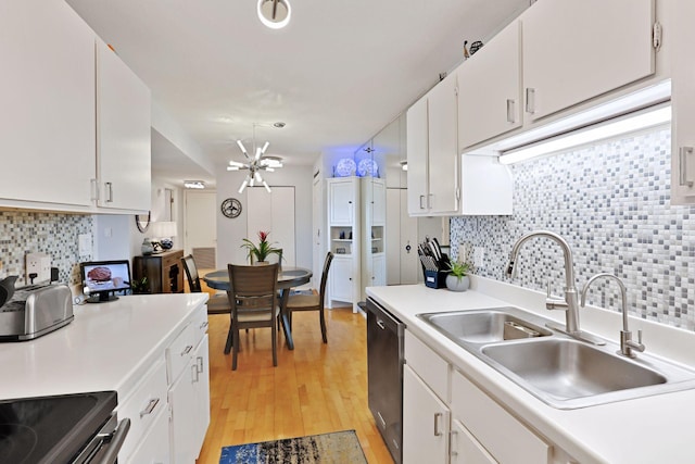 121 Washington Ave S Unit 1816, Minneapolis, MN 55401 - kitchen with dishwasher, a sink, a chandelier, and decorative backsplash