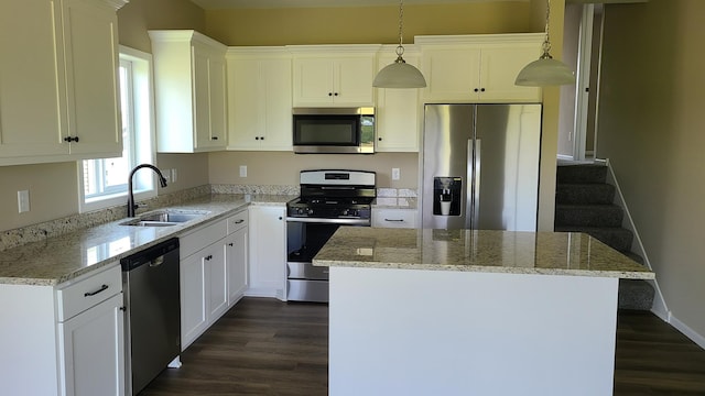 1027 45th Ave NE, Saint Cloud, MN 56304 - kitchen with appliances with stainless steel finishes, a sink, dark wood-type flooring, light stone counters, and white cabinetry