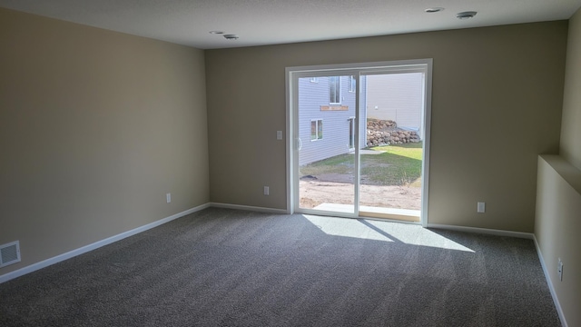 1027 45th Ave NE, Saint Cloud, MN 56304 - carpeted empty room with baseboards and a smoke detector